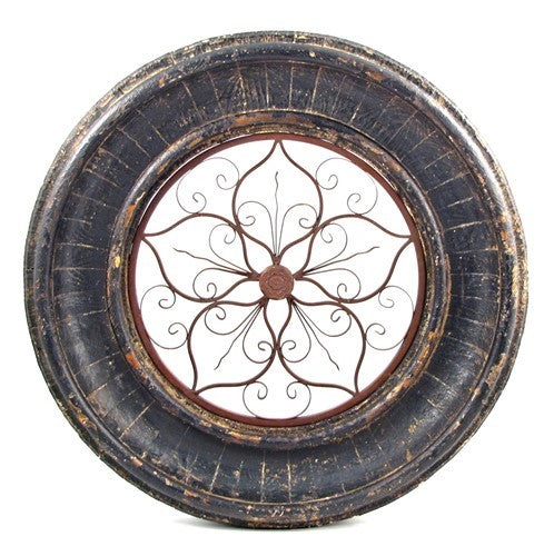 Dark distressed round wooden frame with ironwork shown against a white background