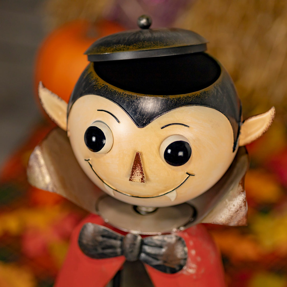 Top view of the vampire head lid lifted above the open candy dish