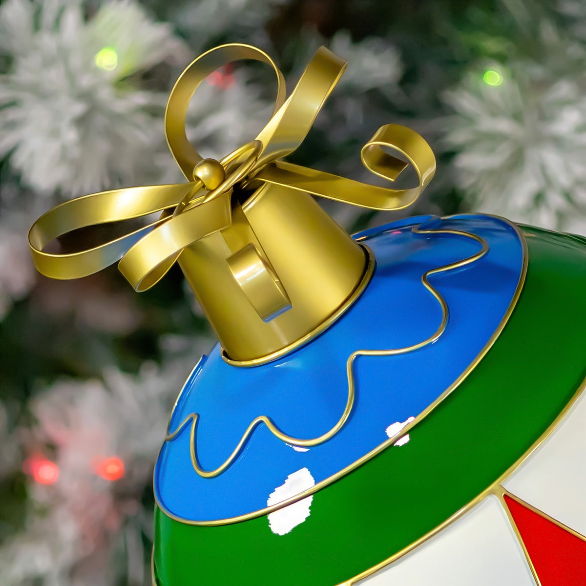 Close-up of the ornament’s gold bow and cap above its blue, gold-trimmed surface.
