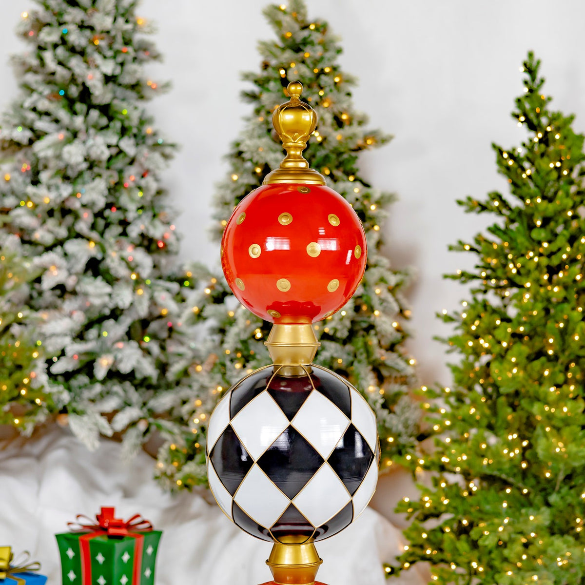 The red dotted and black-and-white patterned ornaments are shown above the tower’s gold collars.