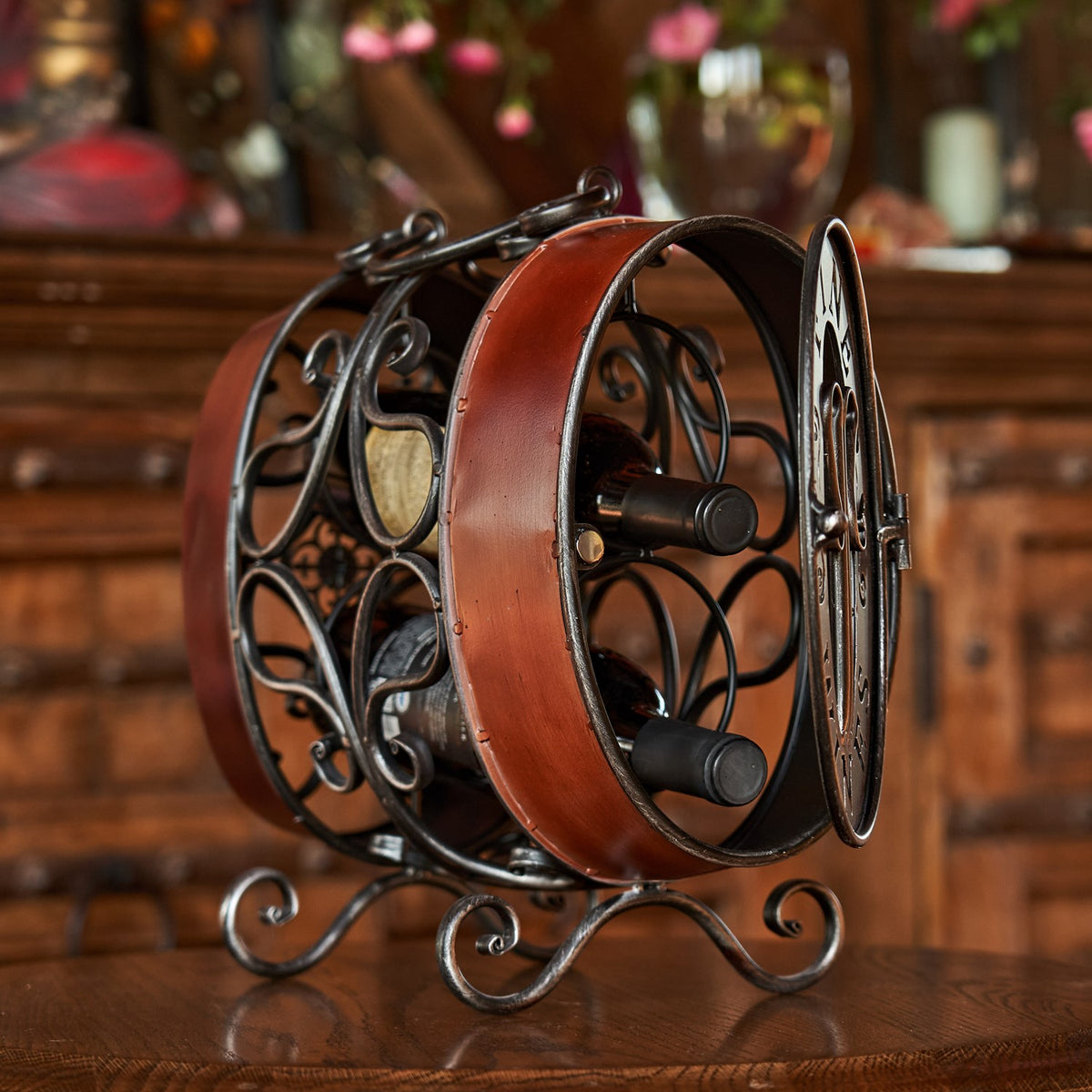 Rear angle of the rack with two dark bottle necks visible through its decorative frame.