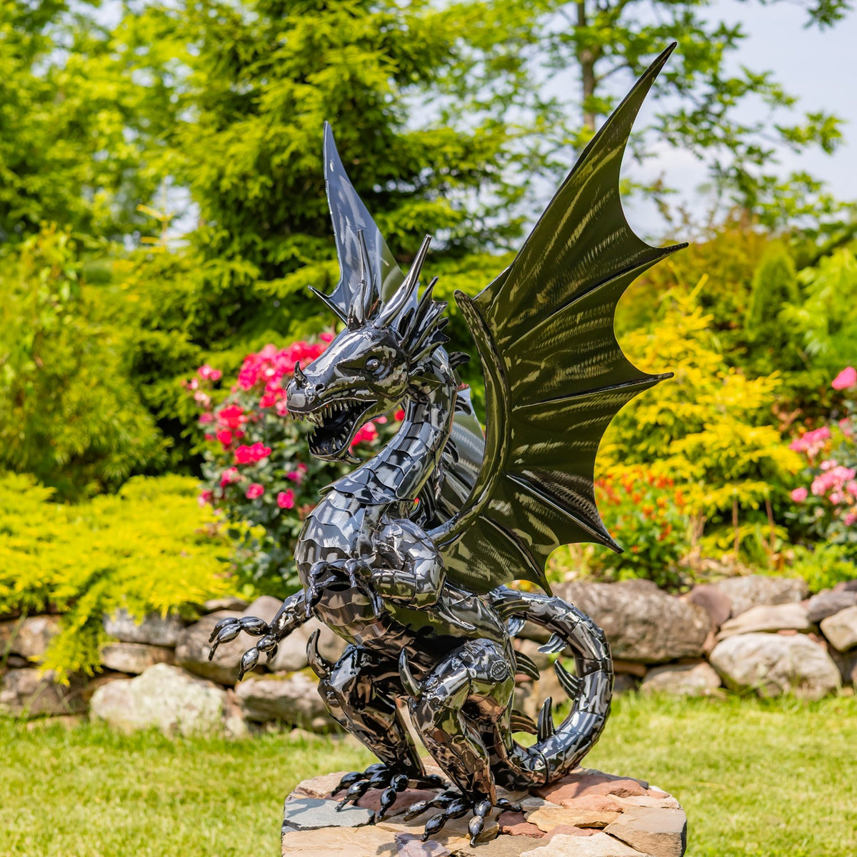 Three-quarter view of the dragon statue showing its curled tail and raised wings