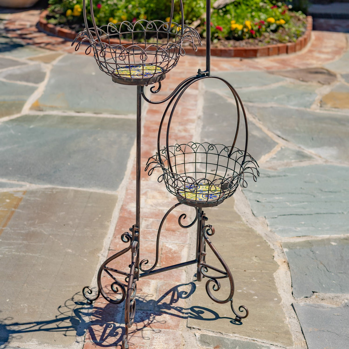 Close view of the empty wire baskets, curved supports, and scrollwork feet