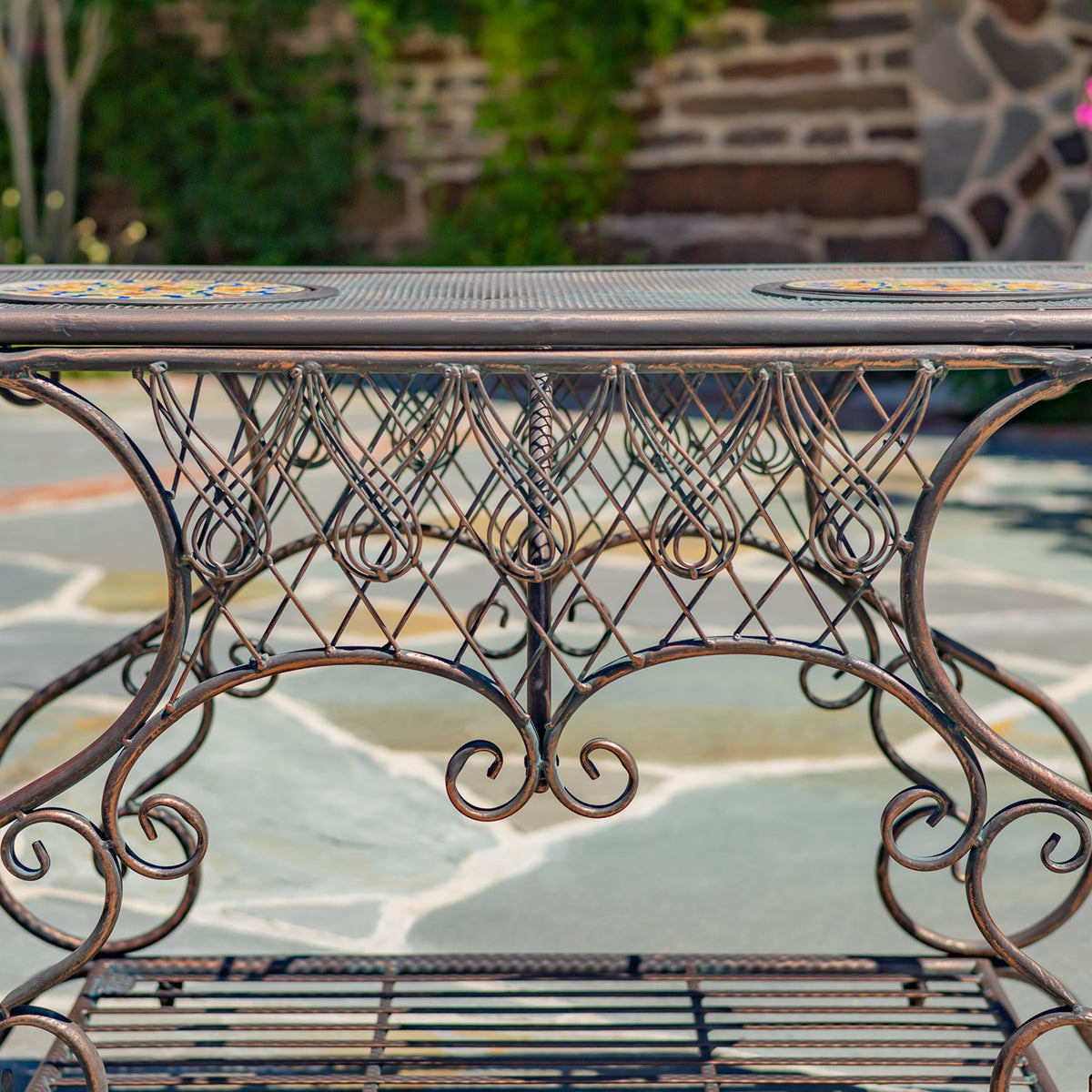 Side view highlighting the table’s scrollwork metal supports, oval rim, and slatted lower shelf.