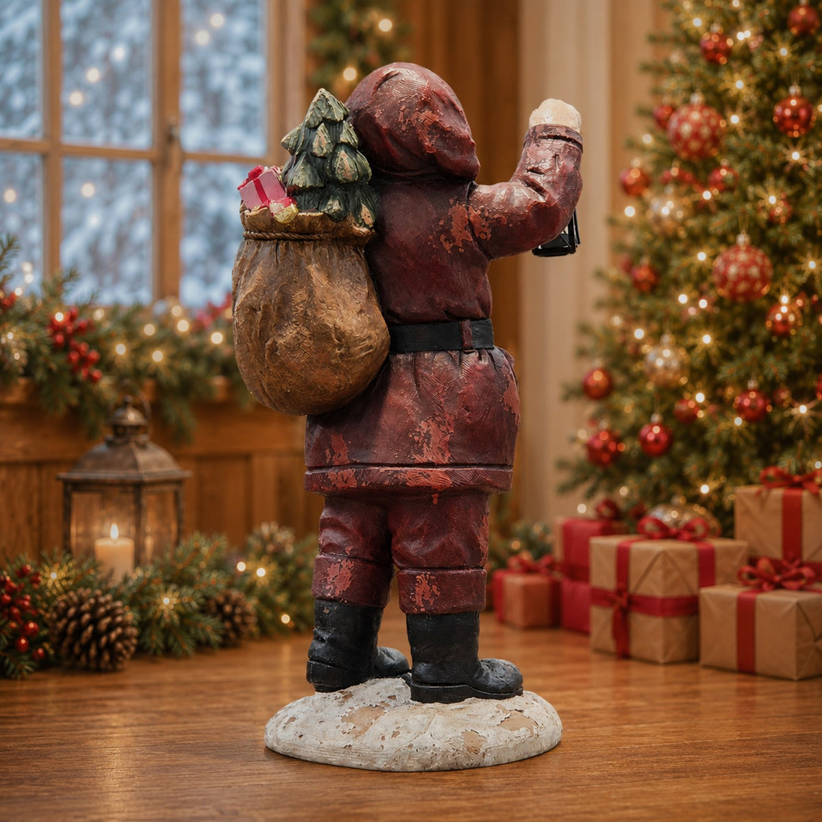 Rear view of Santa figurine with a gift sack in a decorated Christmas room