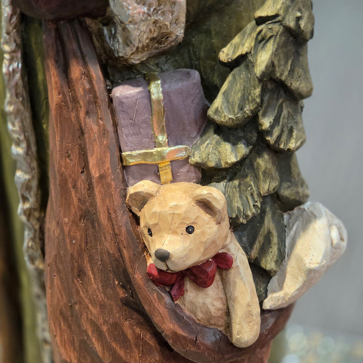 Gift sack detail with teddy bear and miniature evergreen tree