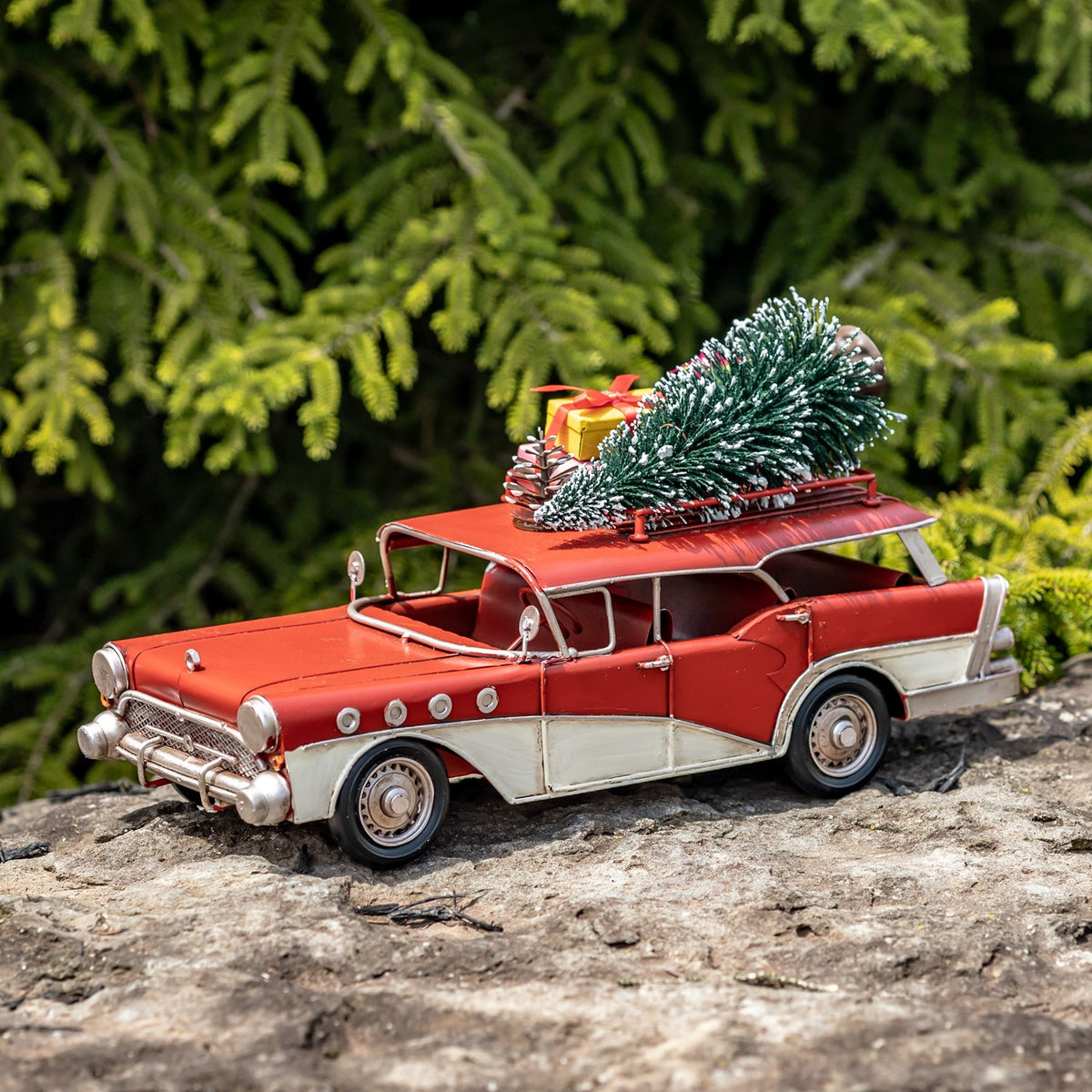 Red-and-ivory wagon with roof decorations viewed from the front side outdoors