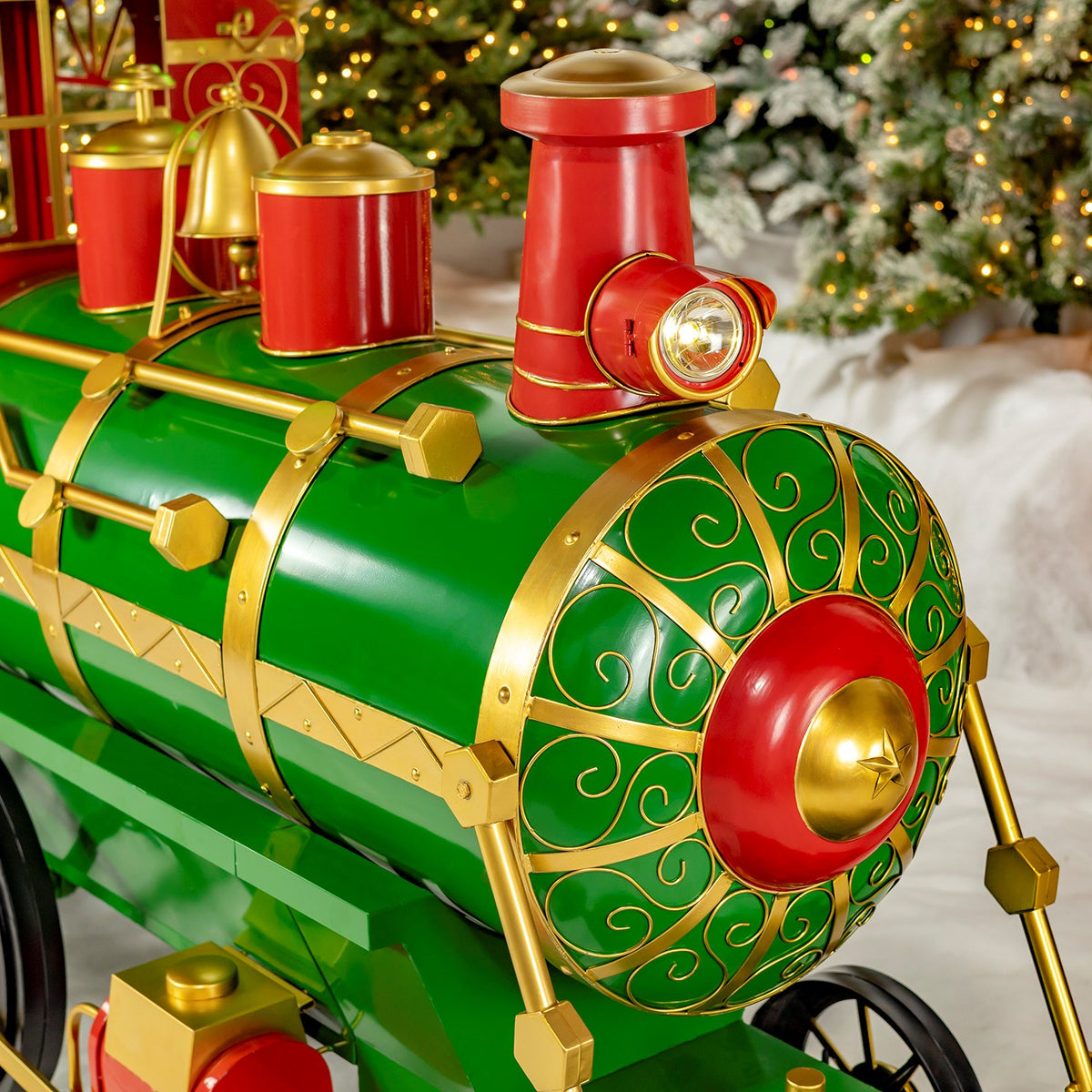 Close-up of the green locomotive front with red and gold accents