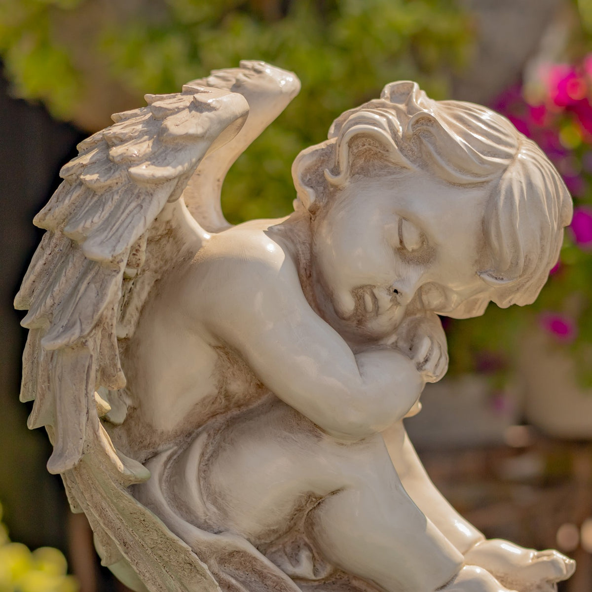 Close-up of a cherub face and layered wing details