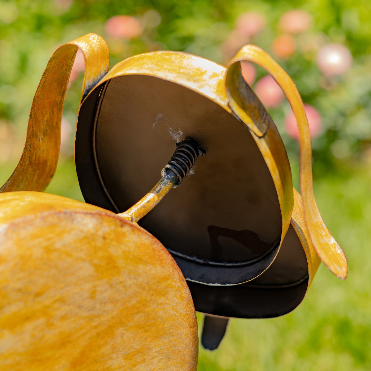 Close-up beneath the dog's head showing the spring-loaded bobblehead mechanism