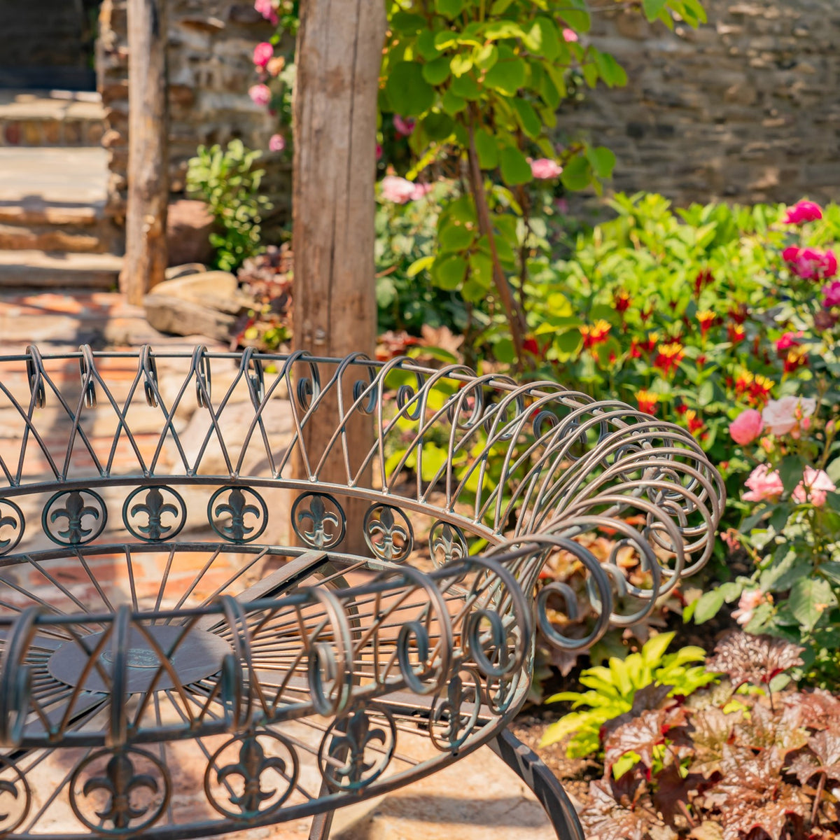 Close-up of overlapping round wire basket rims with curled scrollwork and circular decorative bands.