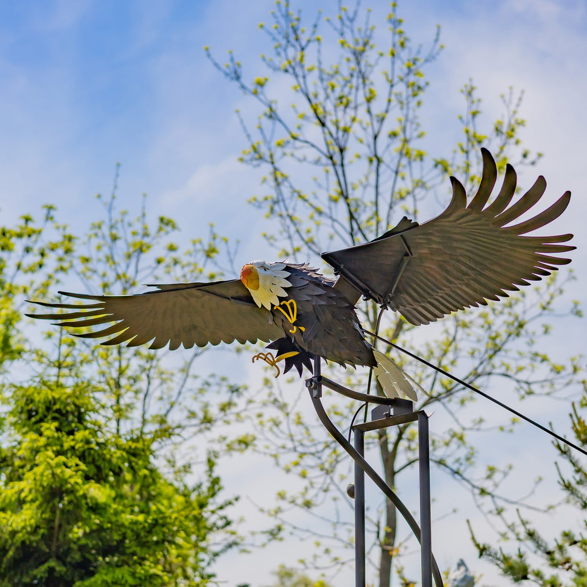 Bald eagle garden stake seen from below with both wings spread wide