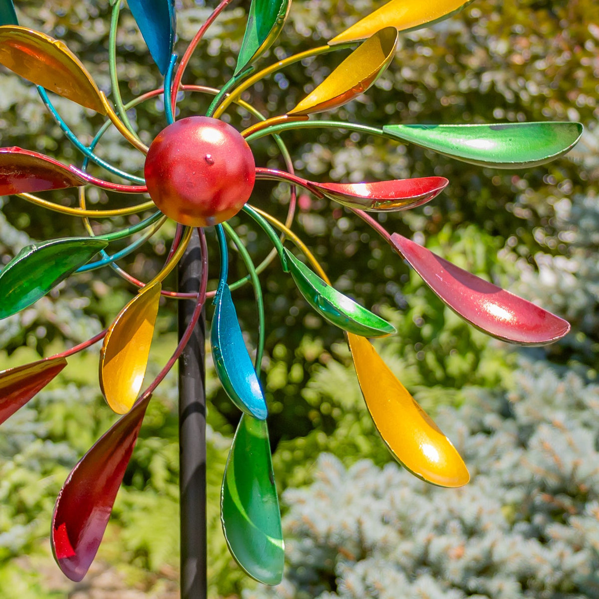 Close-up of hand-painted colorful windmill blades and center hub