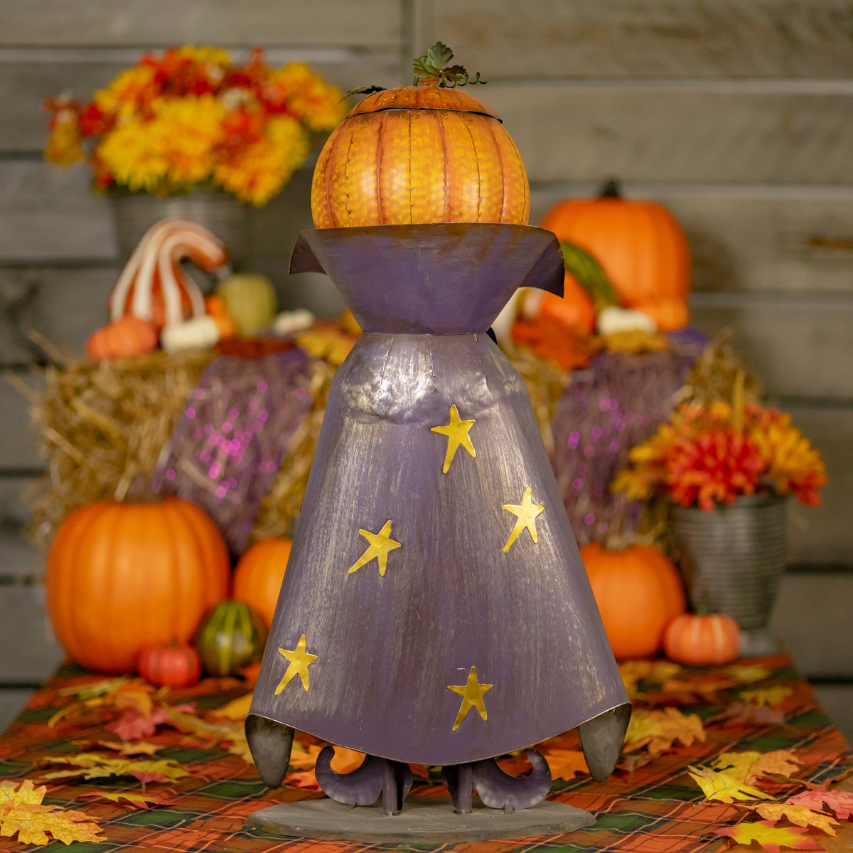 Rear view of the figurine showing its purple cape and star details