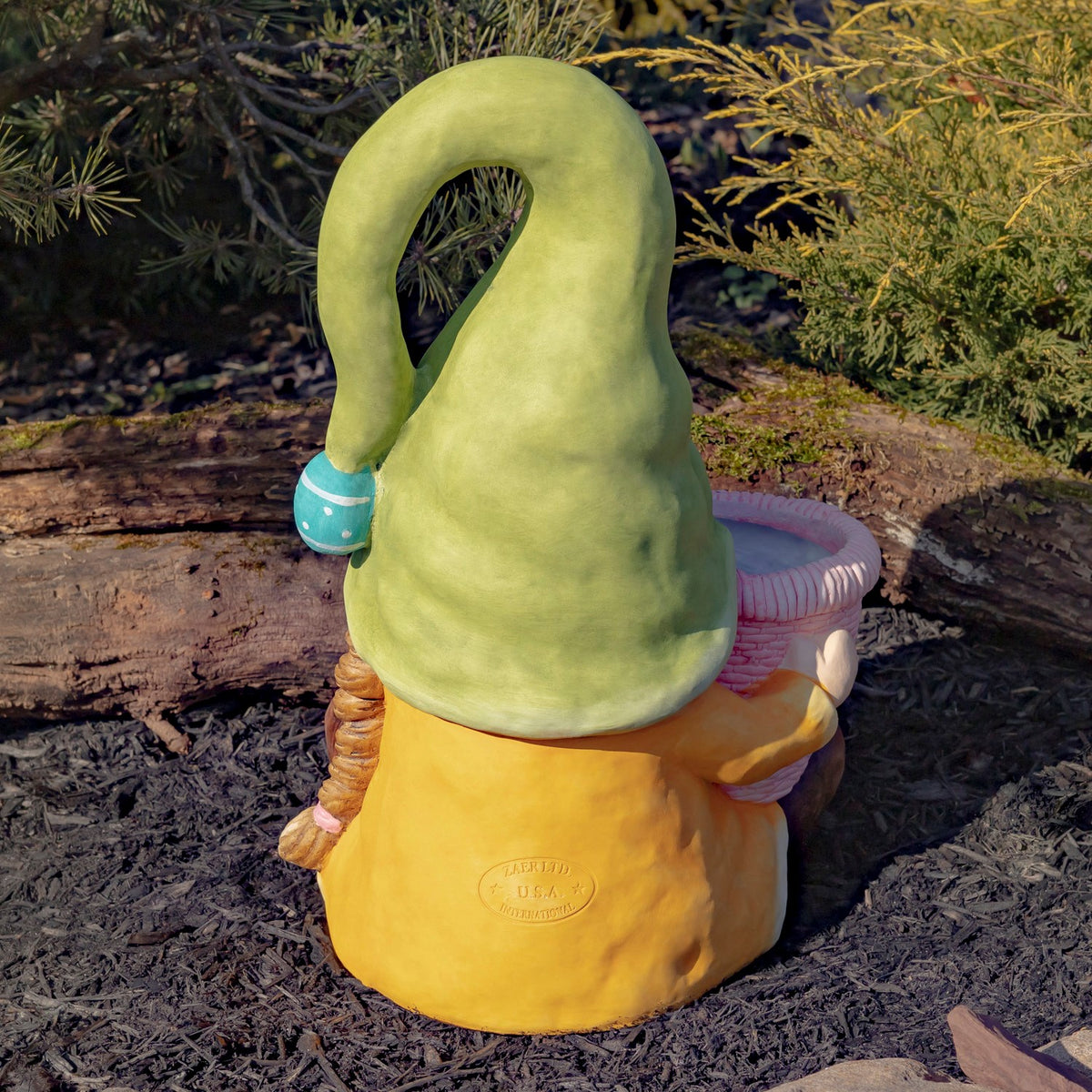 Rear view of the green-hatted gnome, showing its long hat and yellow outfit.