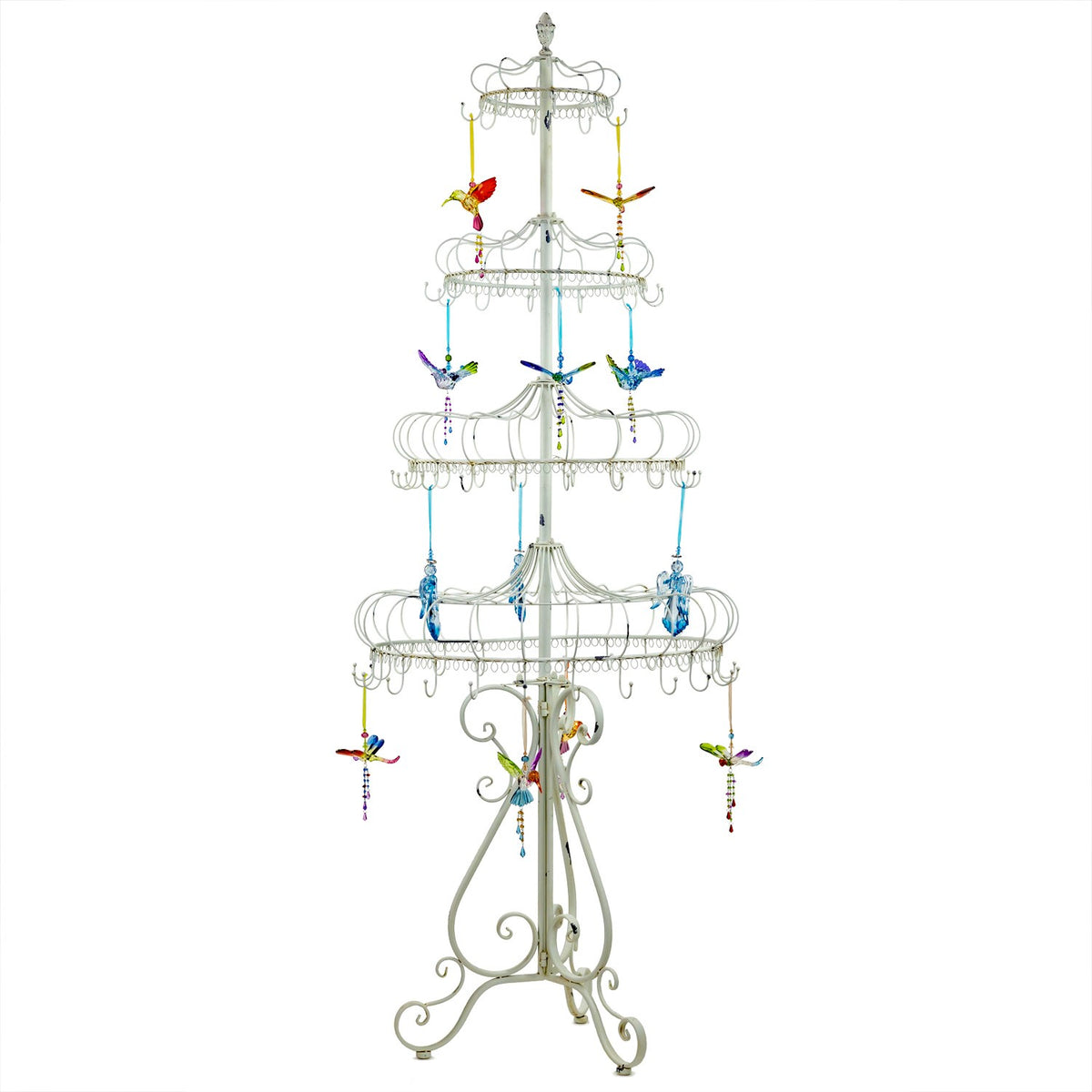 Pale metal display stand decorated with colorful hanging bird ornaments across its tiers.