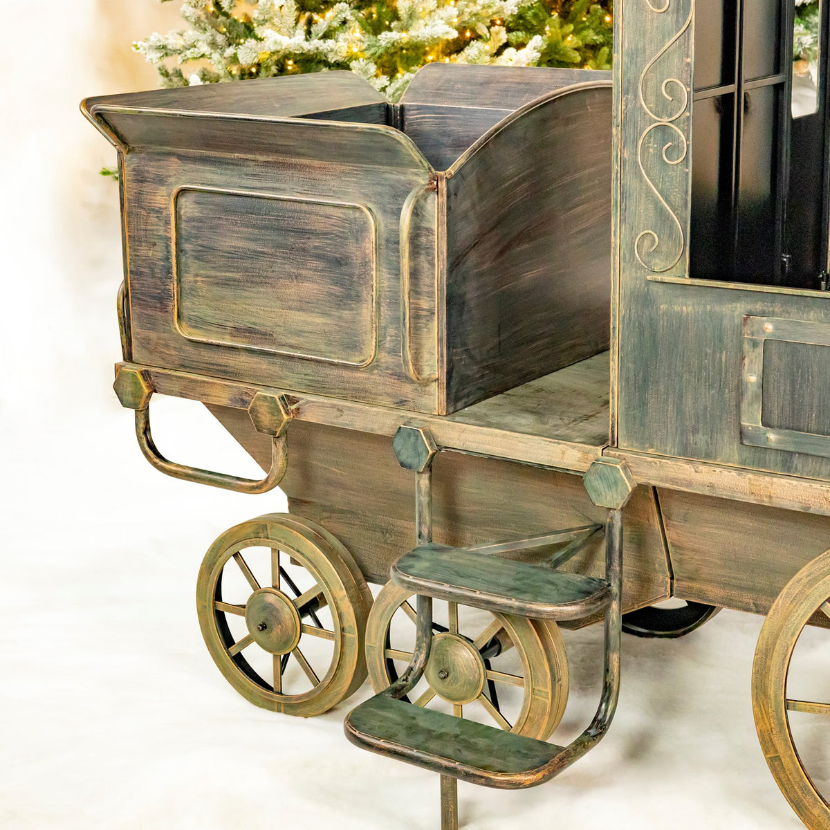 Close view of the train's open rear cart and small wheels