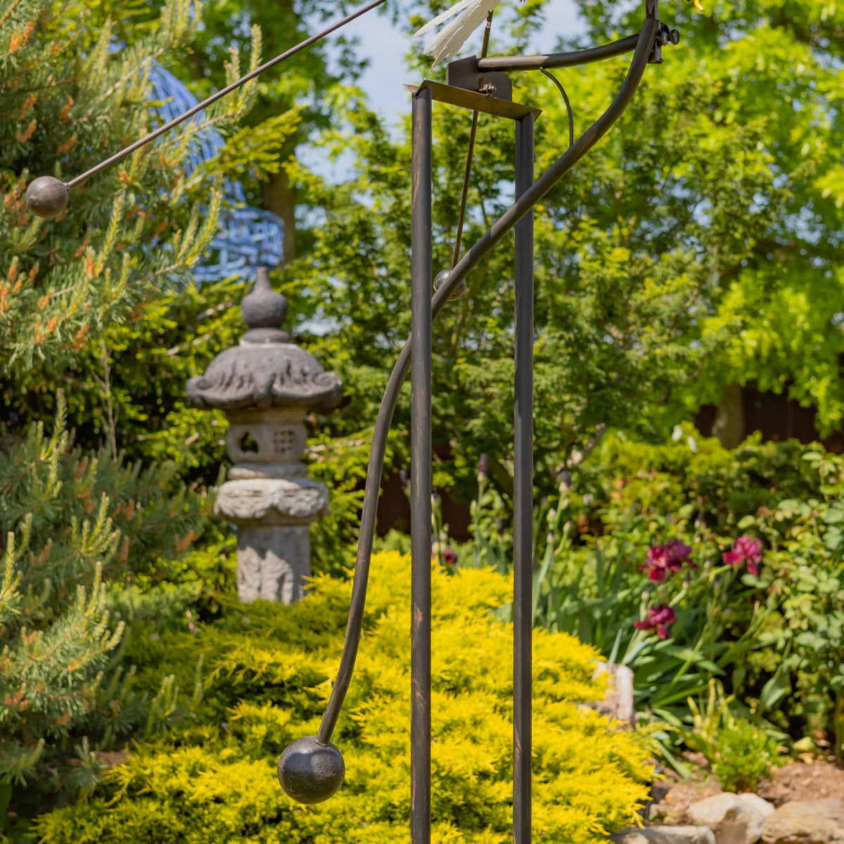 Close view of the iron stake and support rods set in a garden