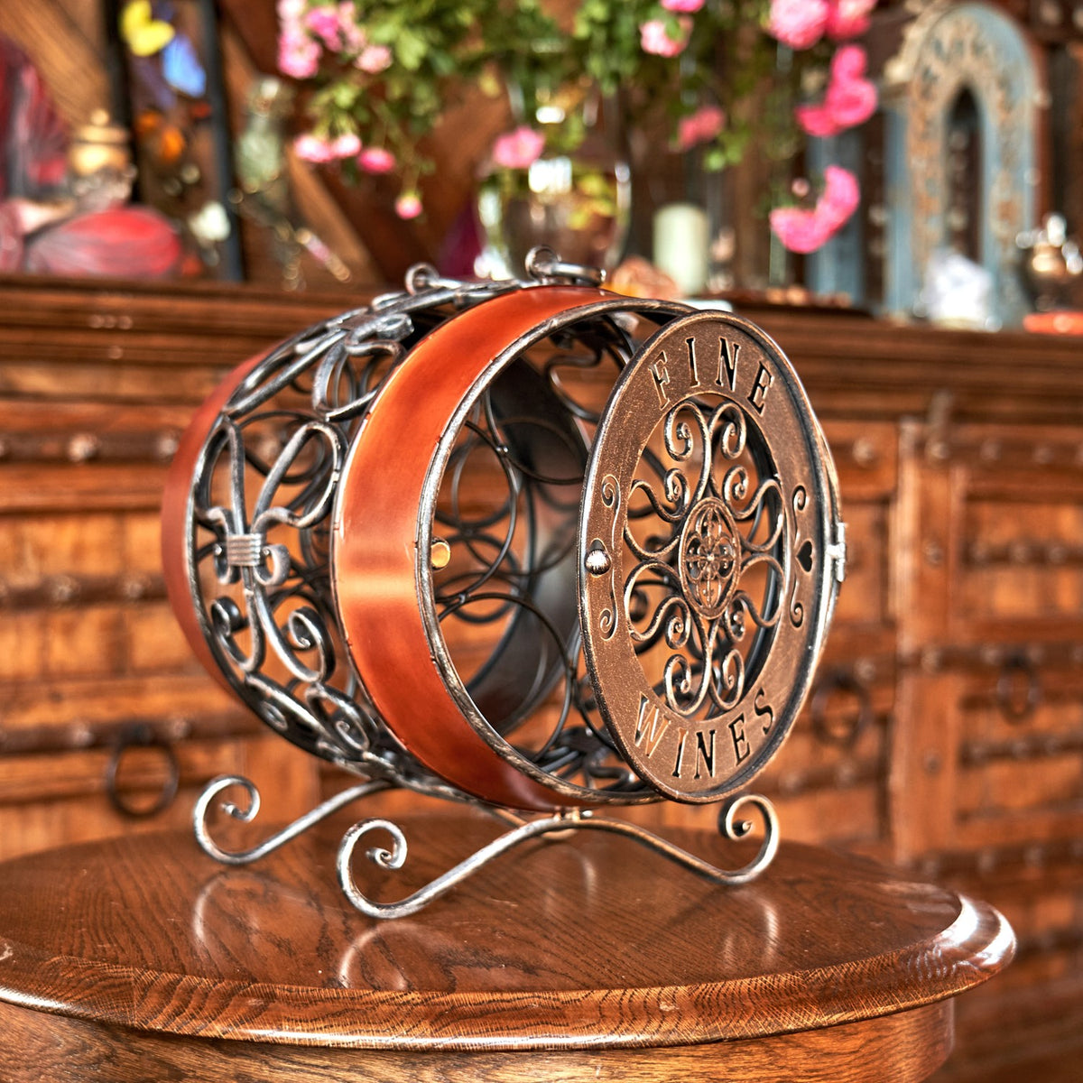 Barrel-shaped wine rack shown from the side, with its round decorative end panel and curled feet visible.