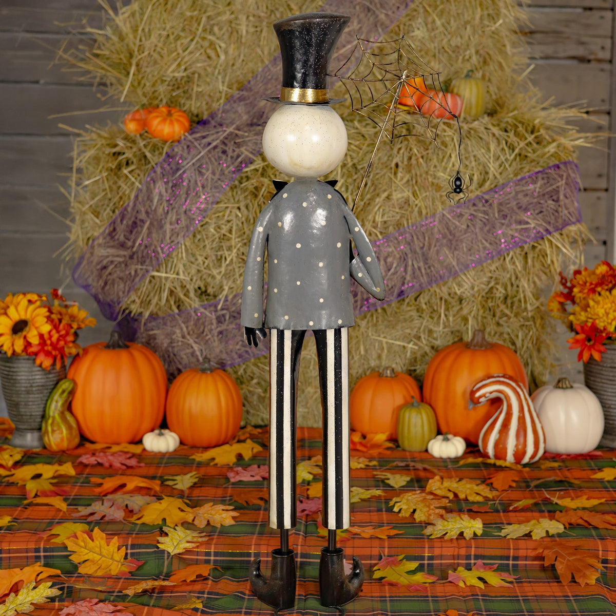 Rear view of the skeleton boy decoration with its spiderweb umbrella