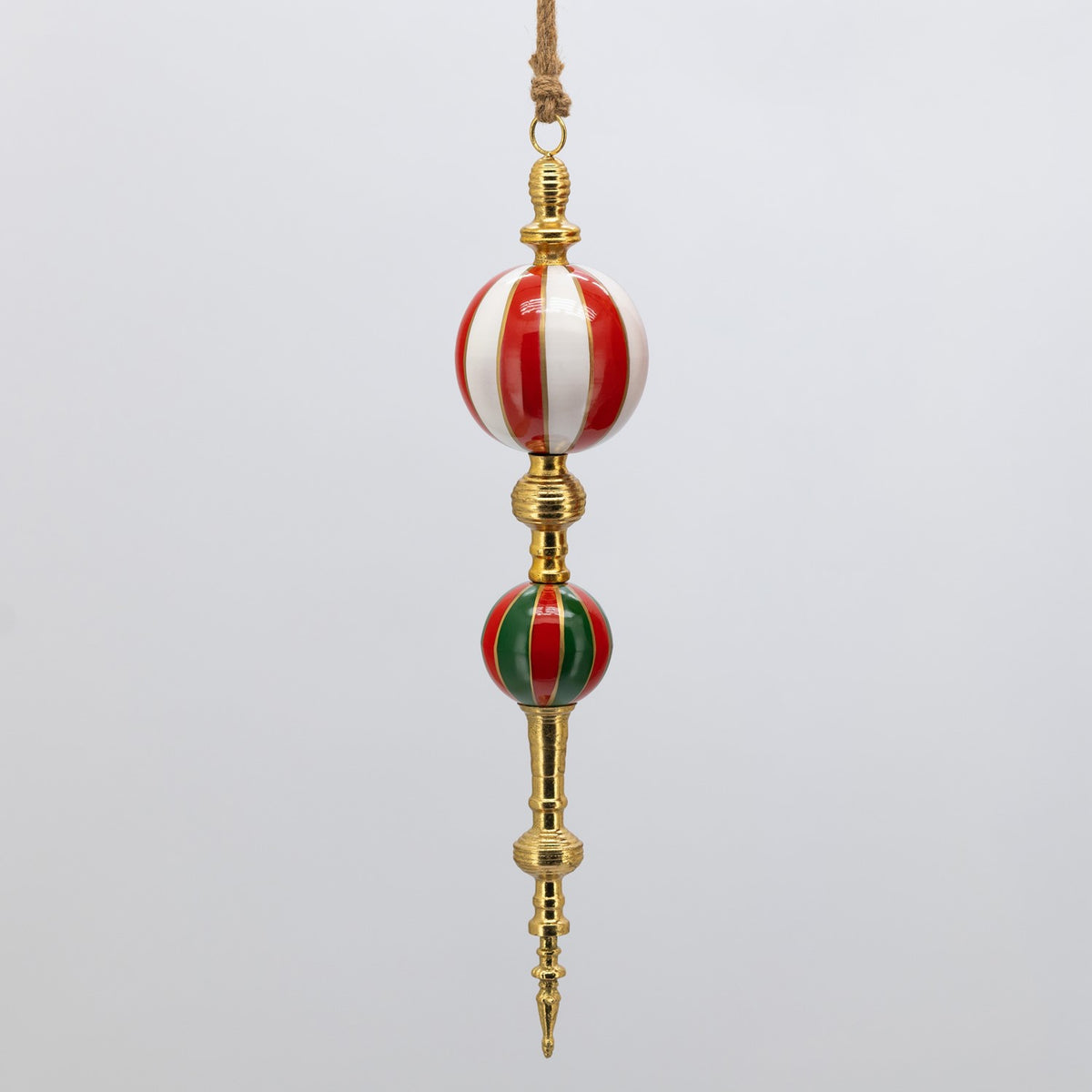 Hanging ornament with a large red and white striped sphere above a smaller red and green sphere.