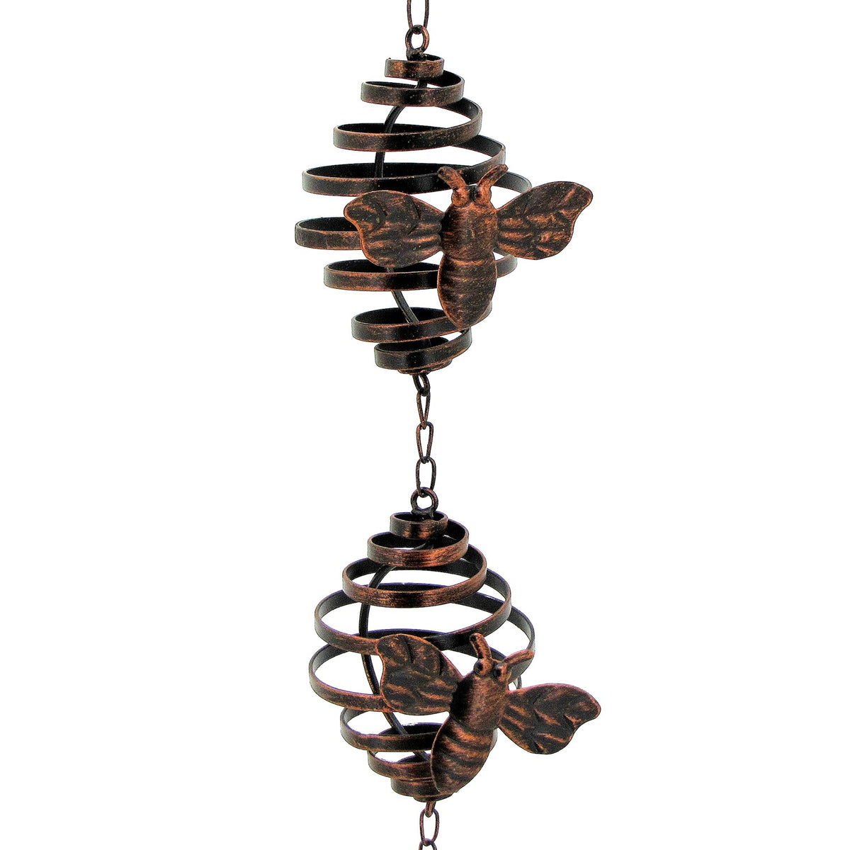 Close view of two bronze spiral sections, each decorated with a honeybee ornament.