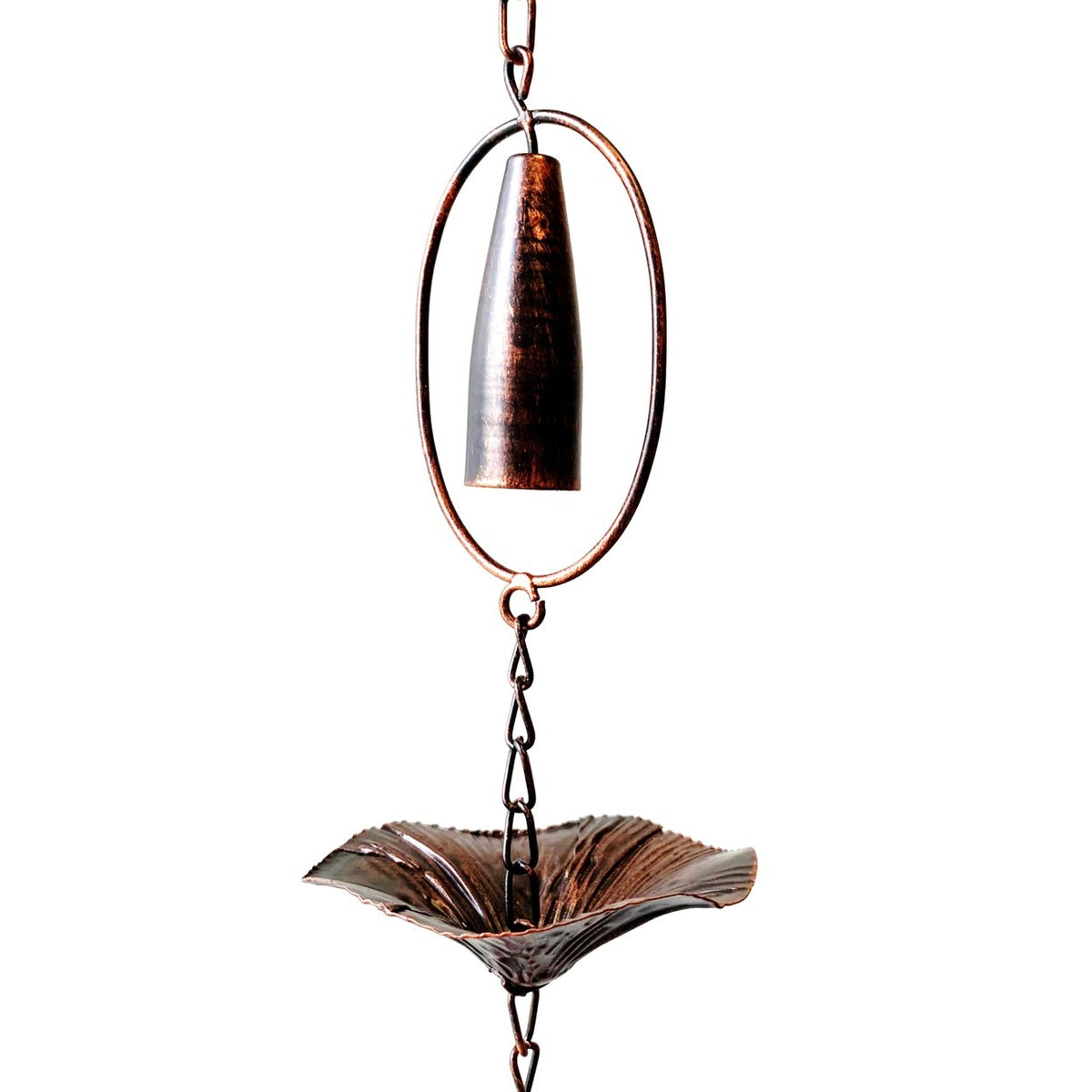 Rain chain detail showing a bronze chime inside an oval loop above a textured mushroom-shaped cup.