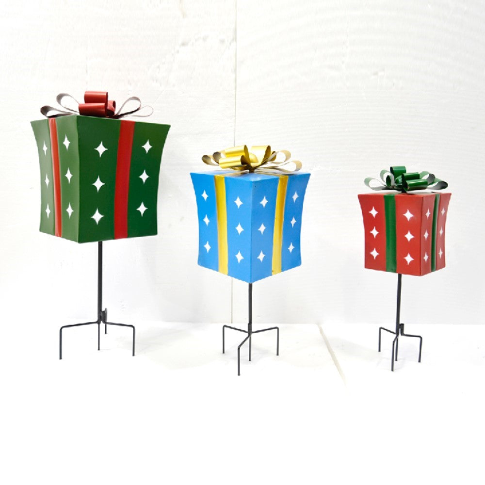 Three gift-box stakes in green, blue, and red, each with a contrasting ribbon and a black metal base.