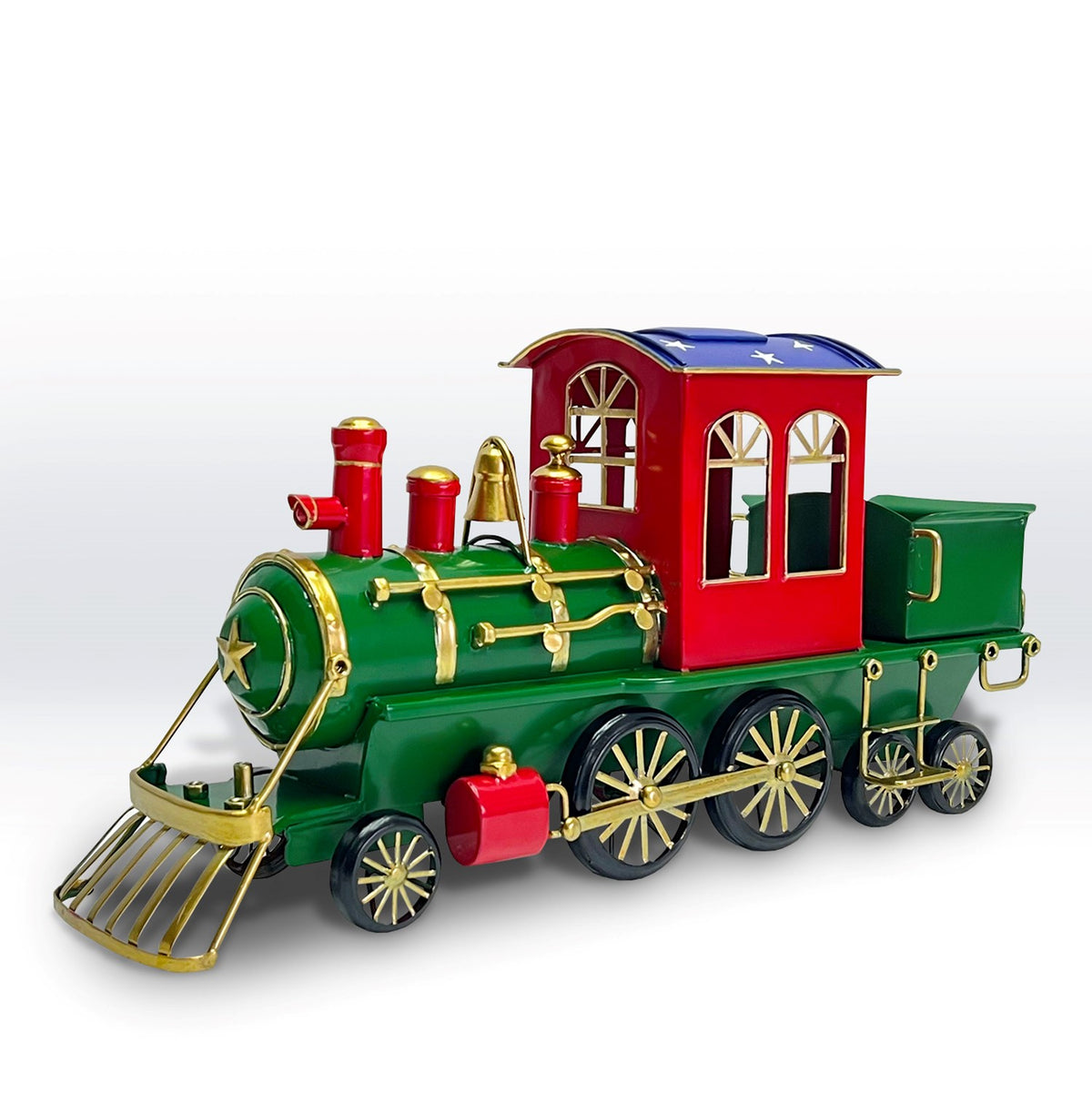 Colorful tabletop train decoration with a green locomotive, red cab, gold trim, and small green rear car.
