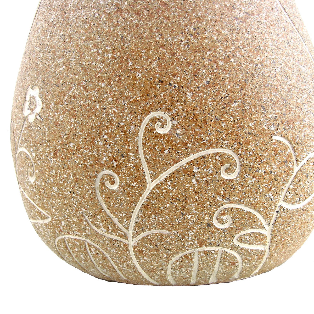 Close-up of a tan speckled bird body with pale etched flowers and curling stems.