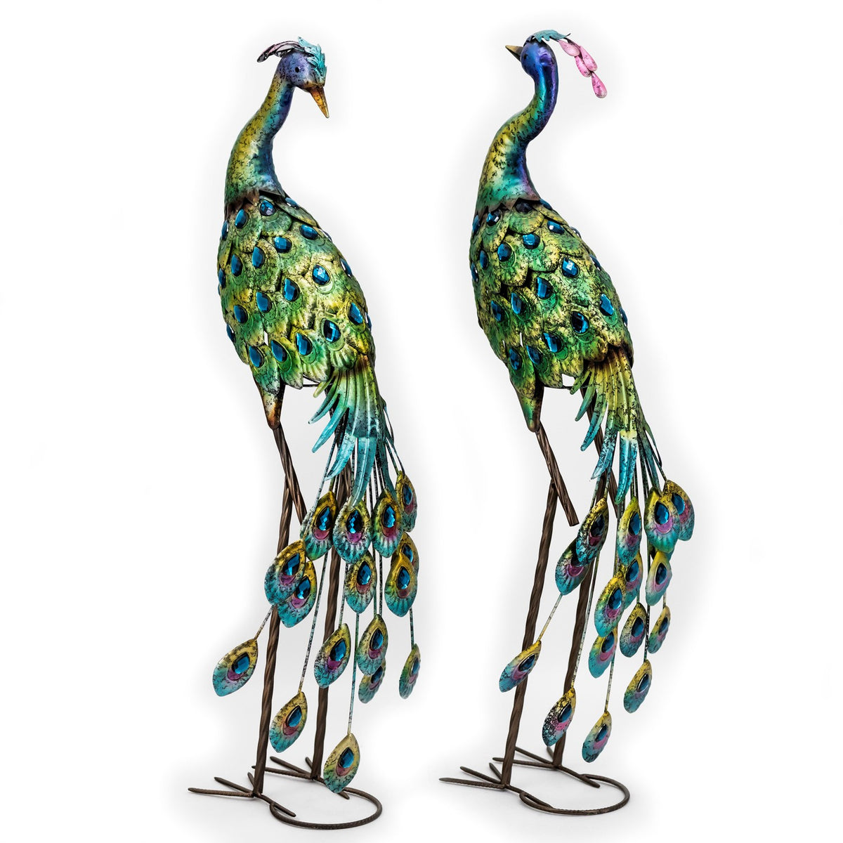 The pair of peacock sculptures shown from behind, with long decorative tail feathers visible.