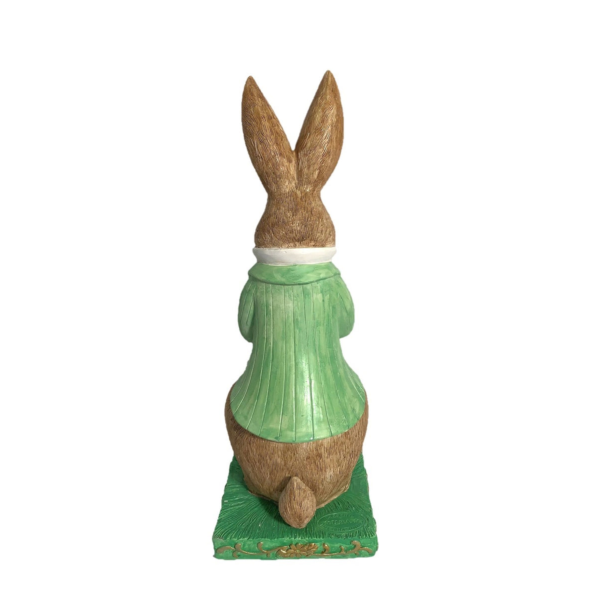 Rear view of the rabbit statue, showing its green coat, brown ears, tail, and rectangular base.