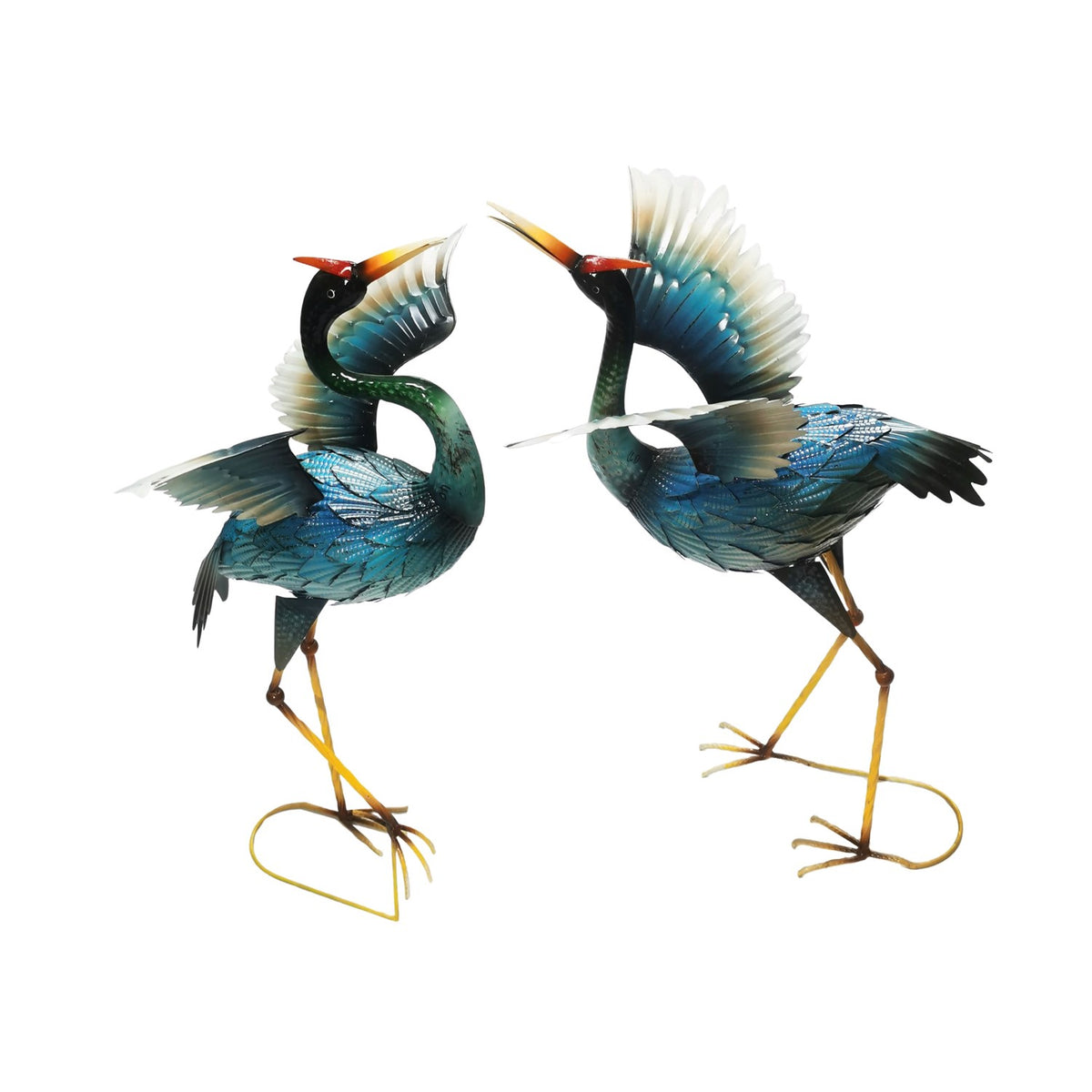 Two blue heron figurines face each other against a plain white background.