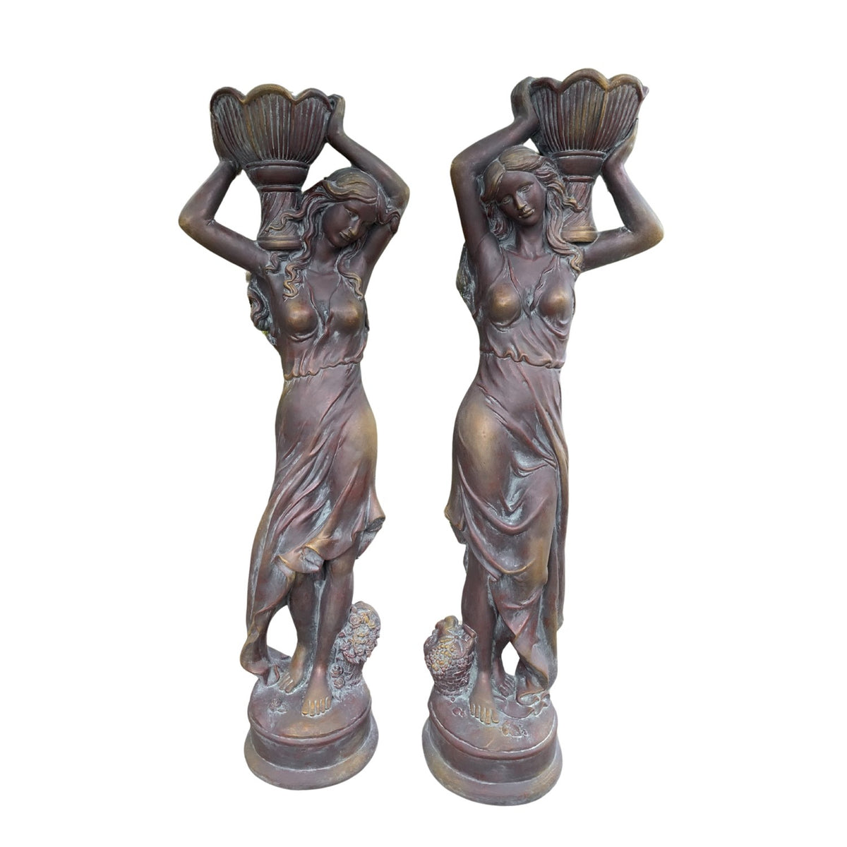 Two matching statues are shown side by side against a white background, each holding a pot aloft.