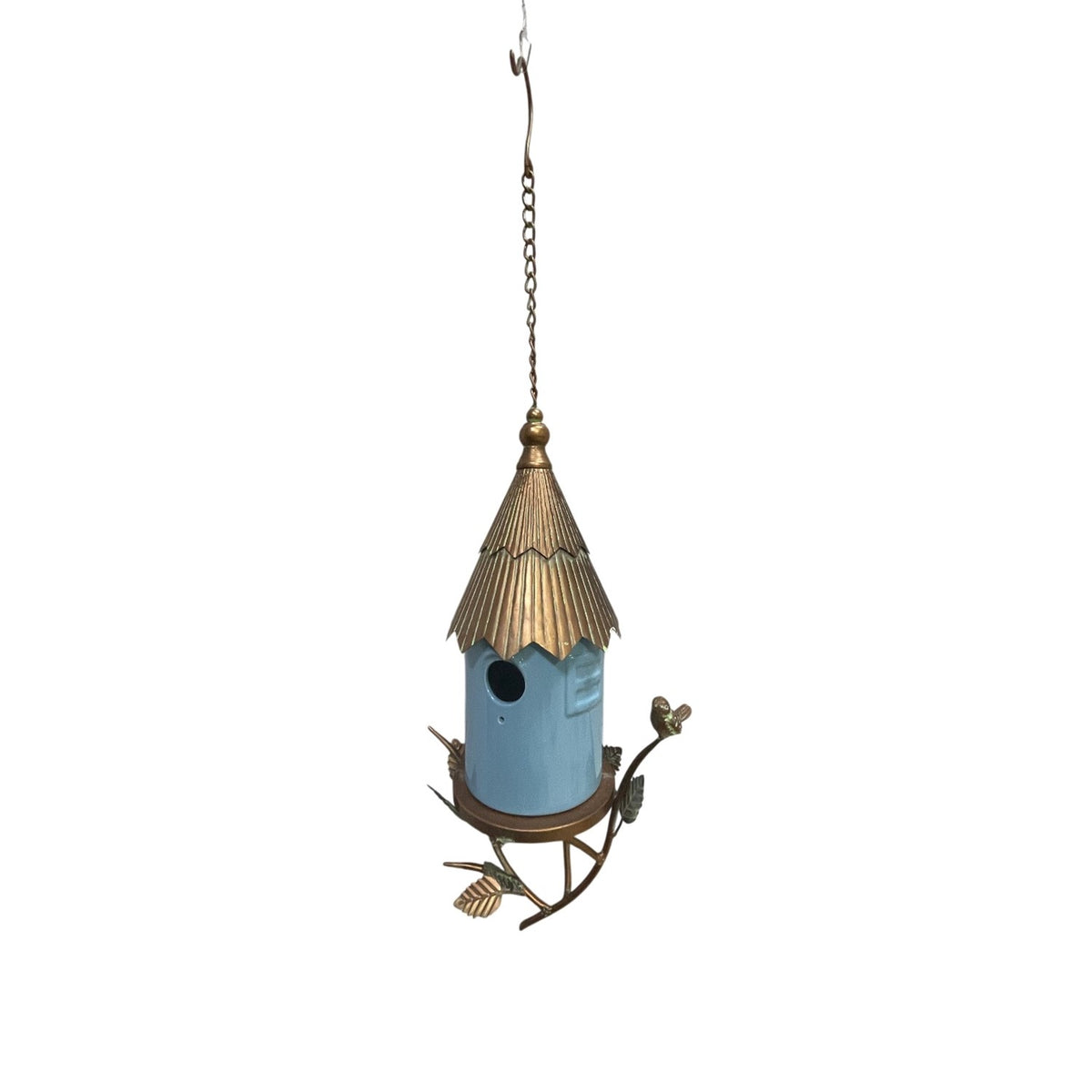 Complete hanging birdhouse with a blue cylindrical body, decorative metal roof, chain, and branch-shaped base.