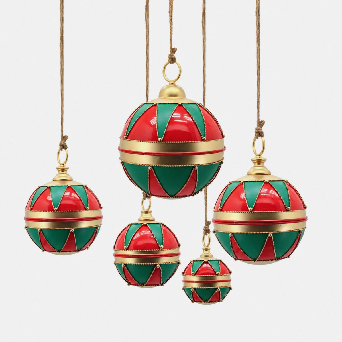 Five hanging spherical ornaments with red and green panels, gold trim, and brown cords against a white background.