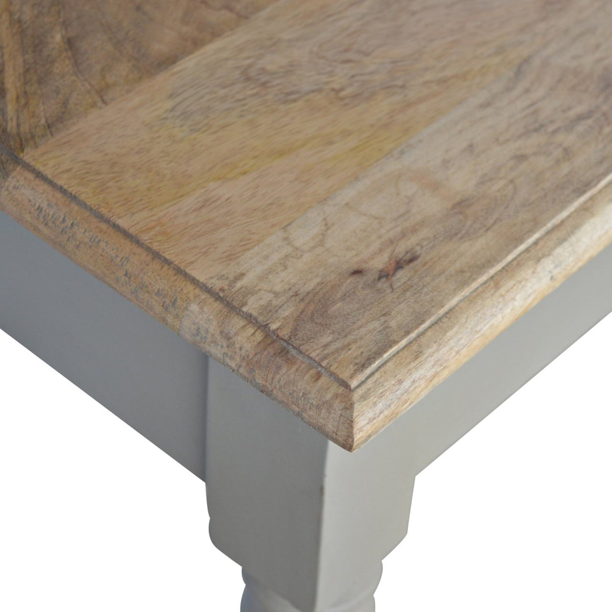Close-up of the stained wood desk top and French grey painted corner