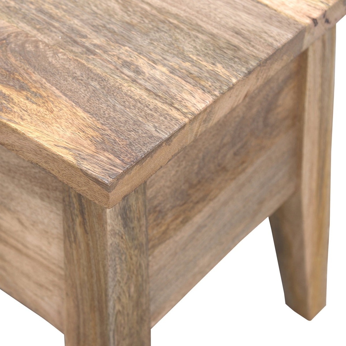 Close-up view of the wood grain and corner of the bench lid
