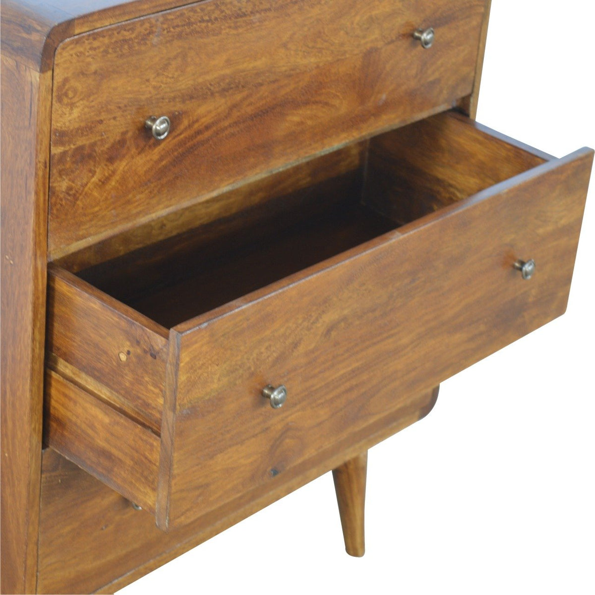 Two open drawers shown at an angle on the chestnut chest of drawers