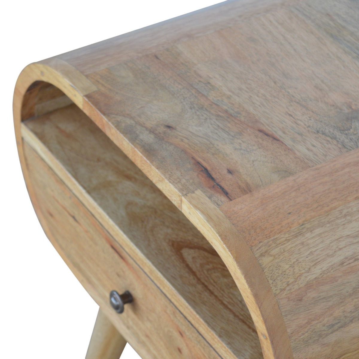 High angled close-up showing the wood grain across the nightstand top and open shelf
