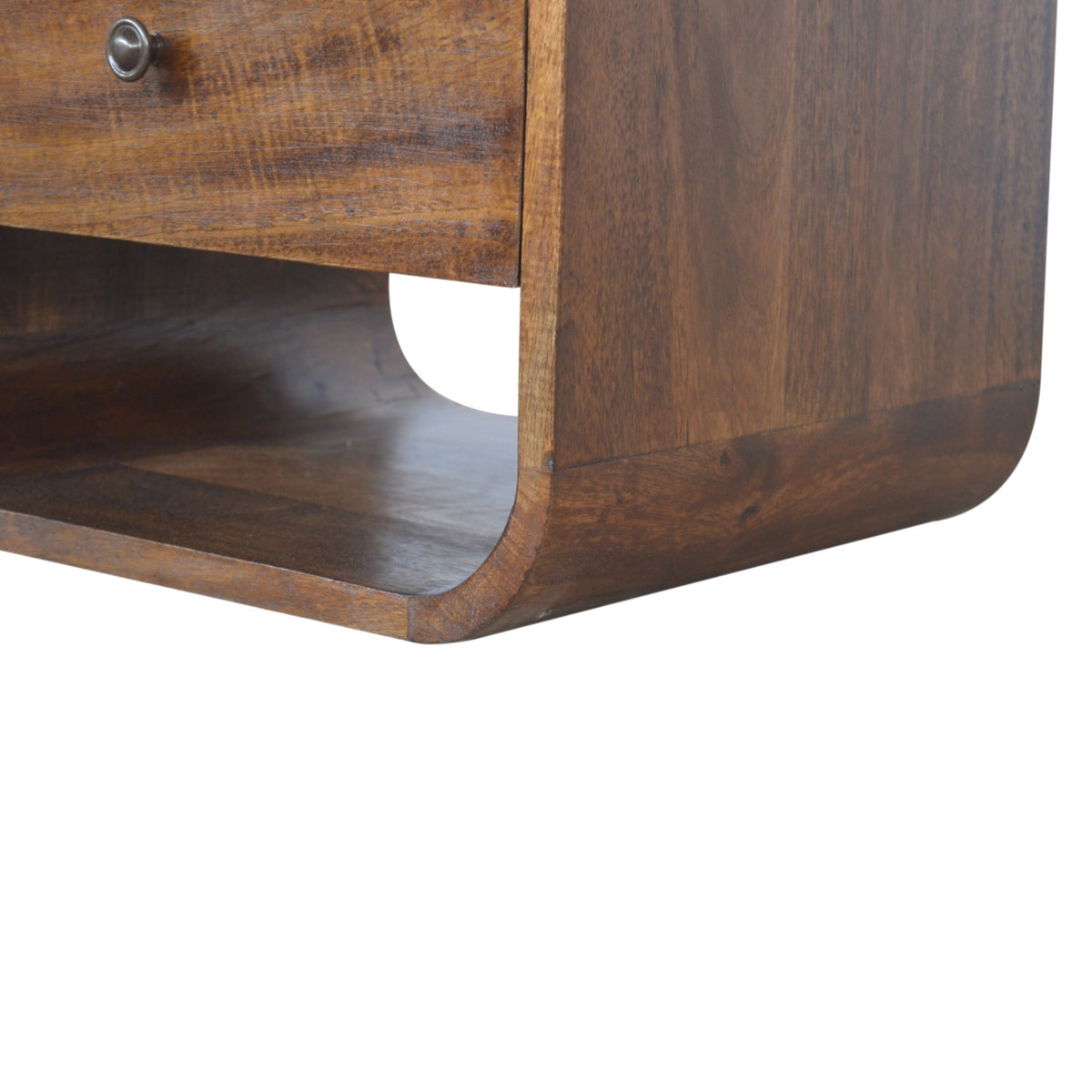Close-up of the lower open slot and rounded side edge of the chestnut-finish nightstand
