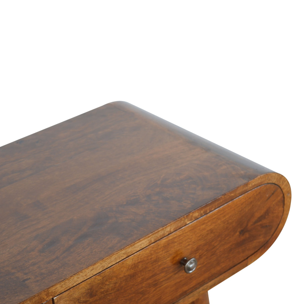Close-up of the chestnut tabletop and rounded table edge