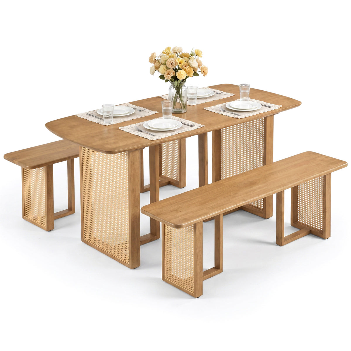 Dining table and two matching benches styled with place settings against a white background.