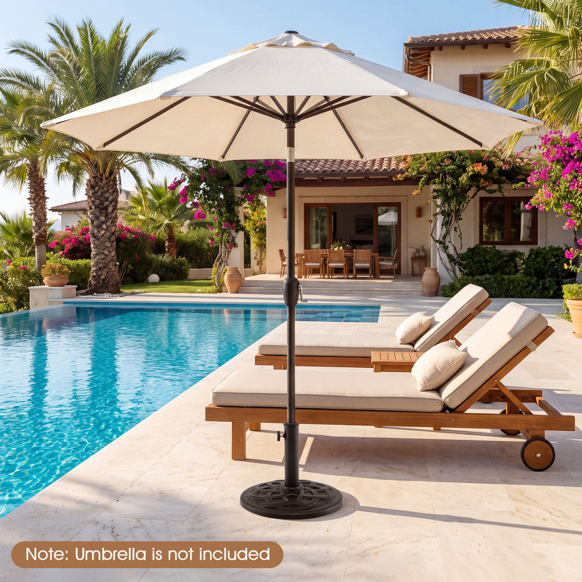 Black umbrella base supports a large cream patio umbrella beside a pool and wooden loungers.