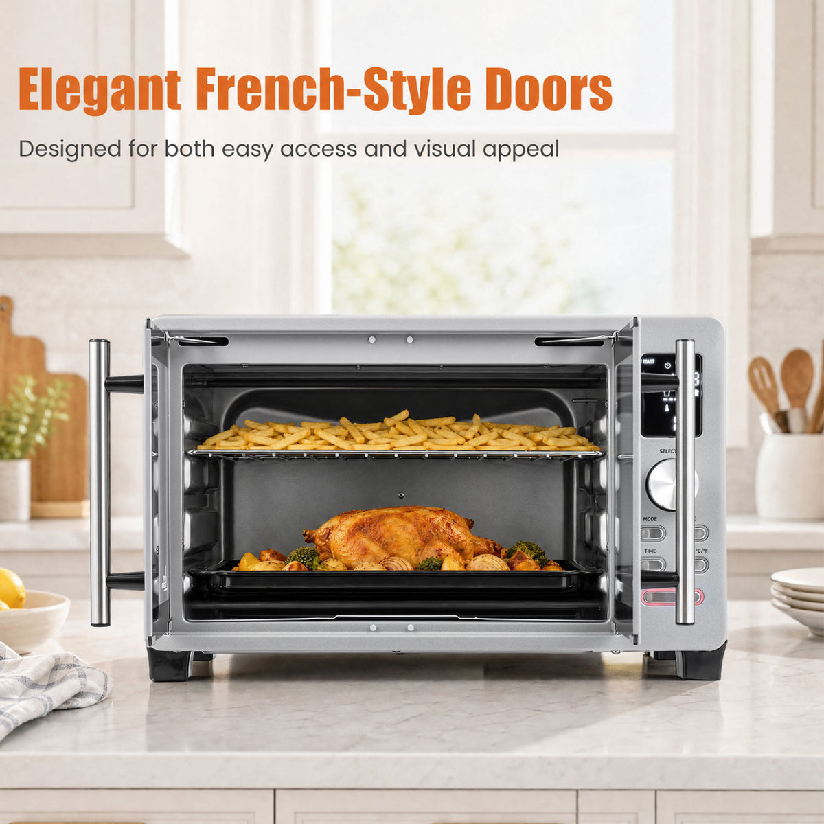 Stainless steel countertop oven with both French doors open, showing fries above a roast chicken.