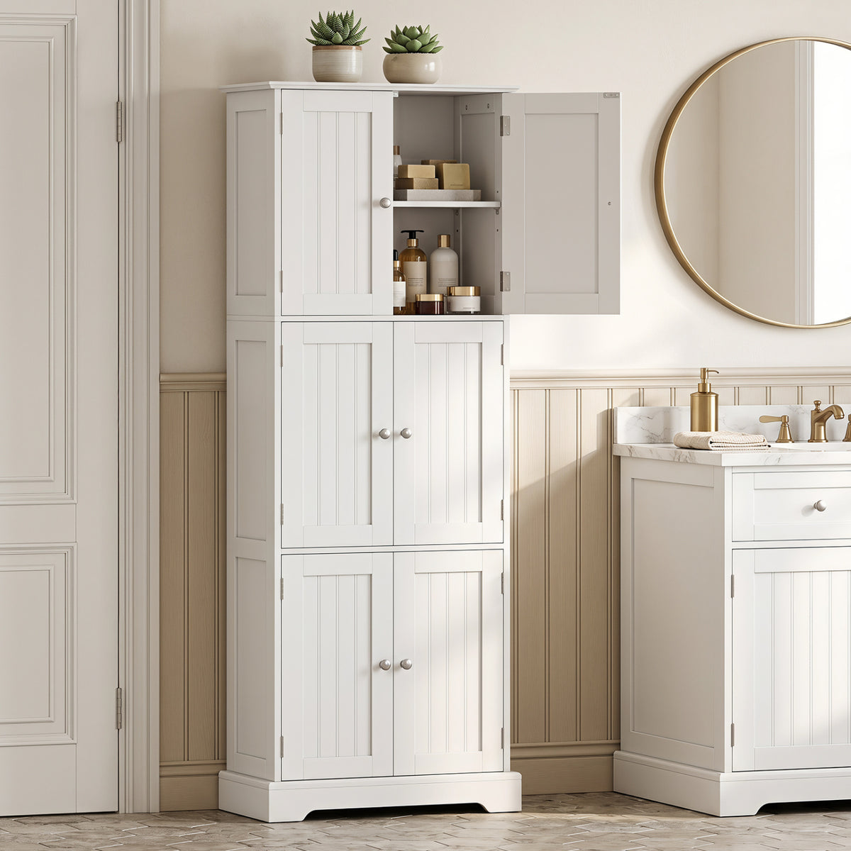 White paneled storage cabinet with an open upper door beside a bathroom vanity and round mirror.