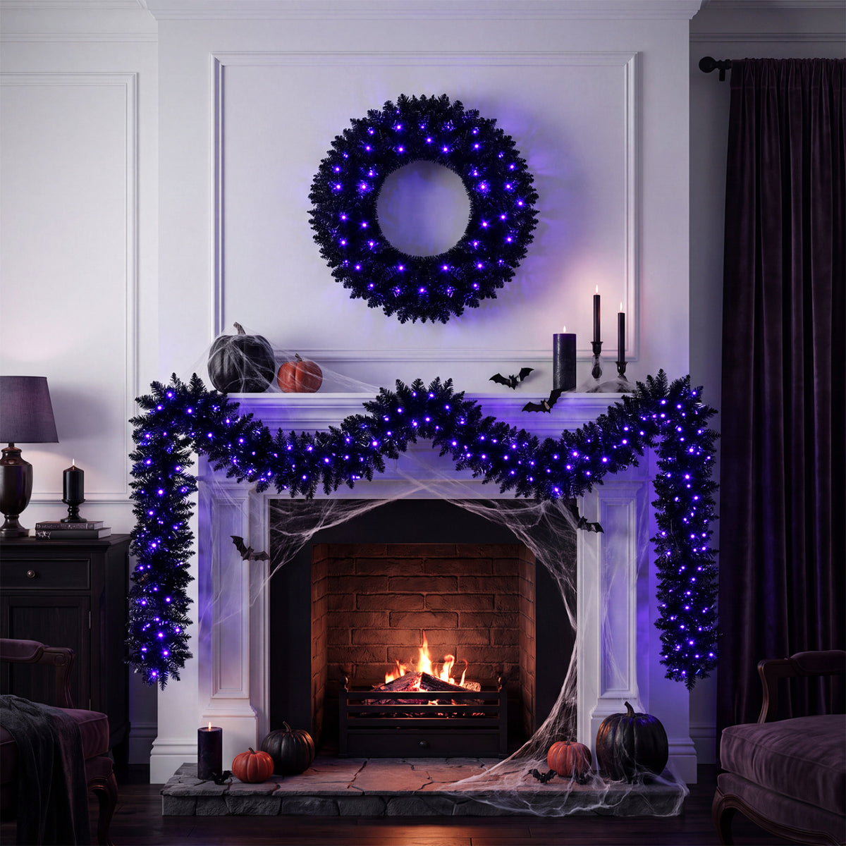 Blue-lit wreath hangs above a fireplace draped with matching garland and Halloween decorations.
