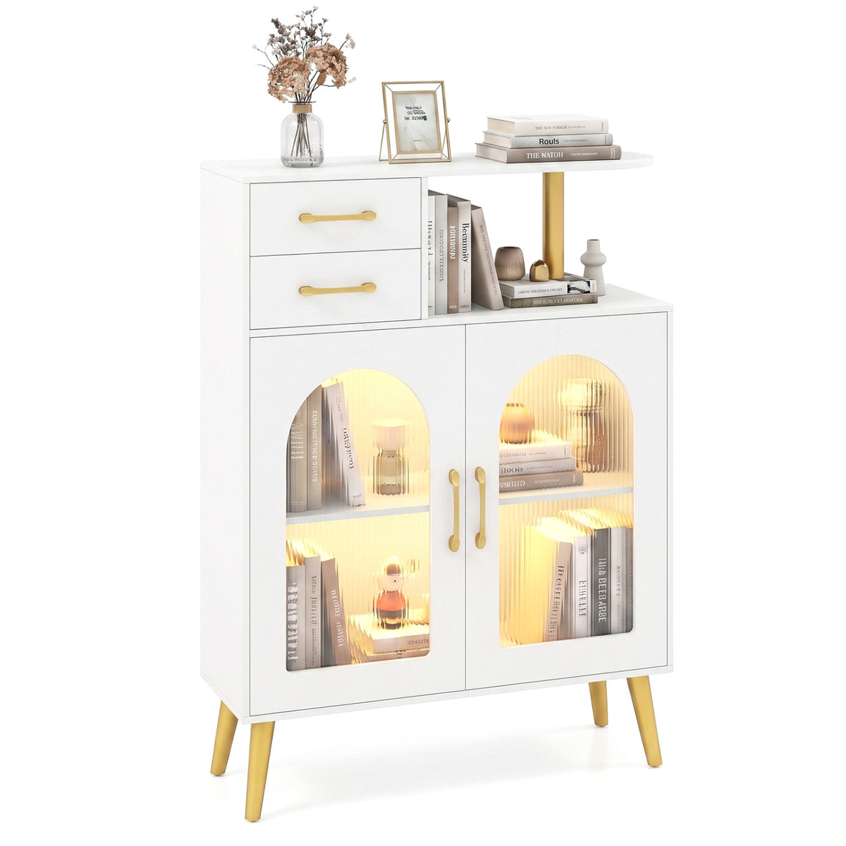 White sideboard with books and decor, shown with warm light glowing behind its translucent doors.
