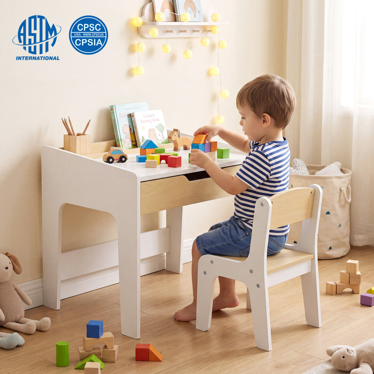 Child seated at the matching desk and chair, playing with colorful blocks.
