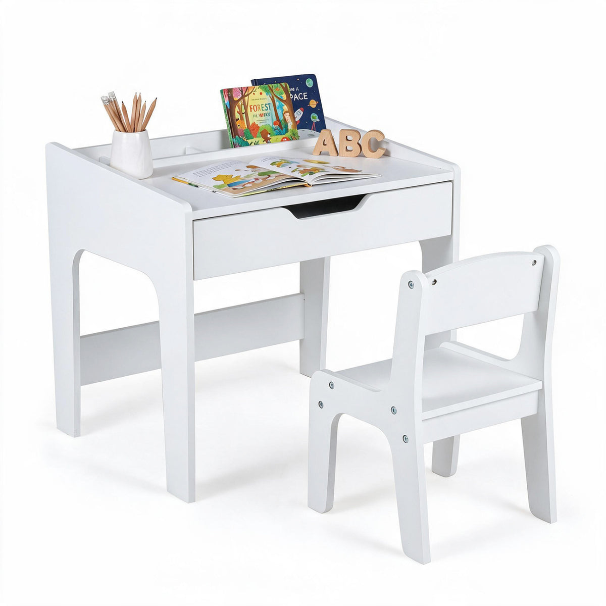 White desk and chair with books, pencils, and letter blocks arranged on the desktop.
